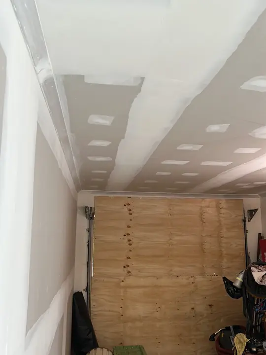 Garage ceiling after suspect sheeting was safely removed and the area cleared.